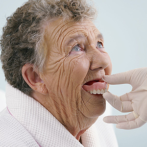 Elderly Woman Trying on Dentures