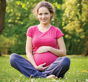 Pregnant Woman touching her tummy