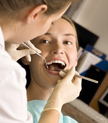 Woman having professional teeth cleaning procedure